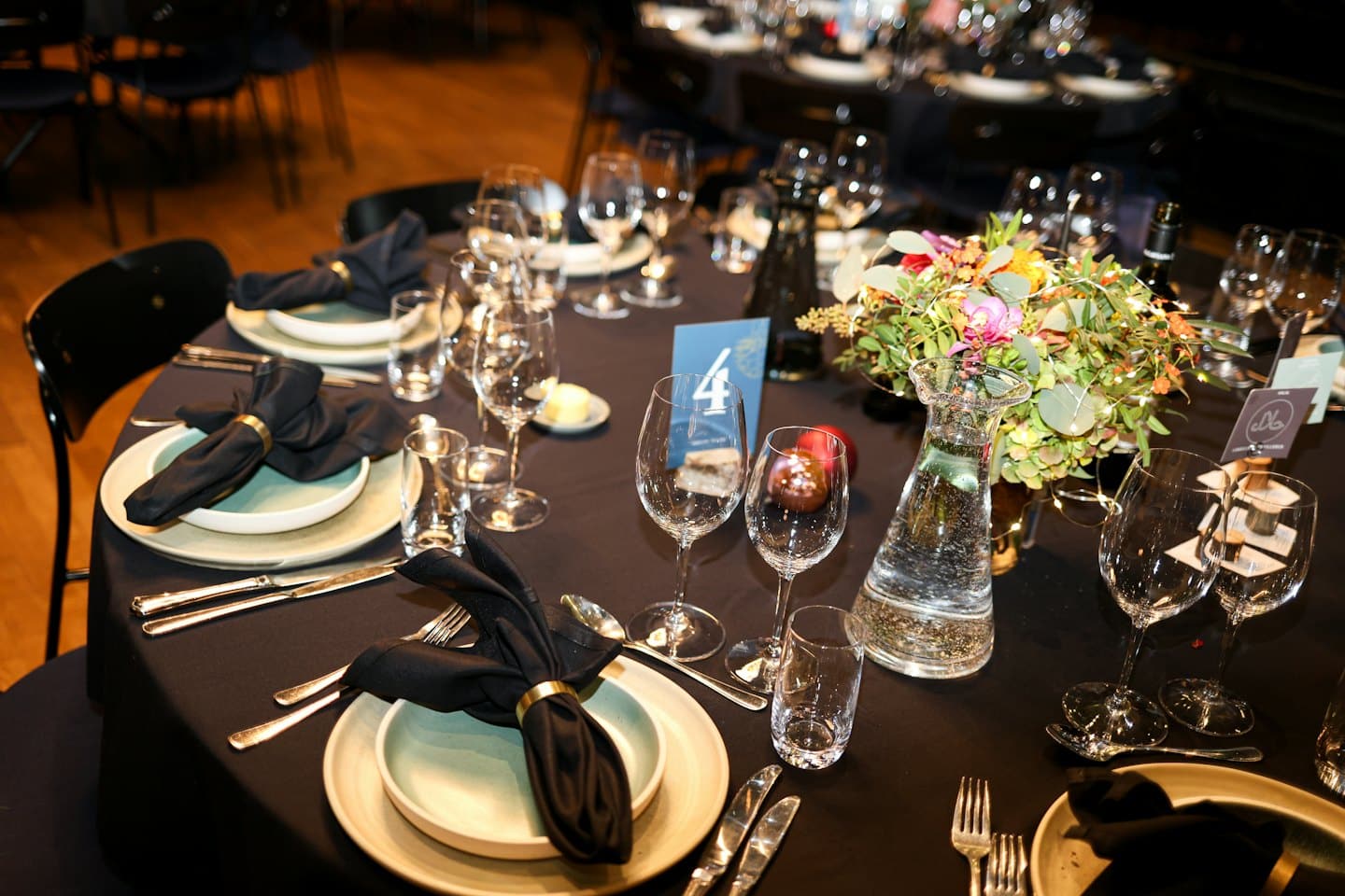 Elegant dining table set with floral centerpiece for a special event.