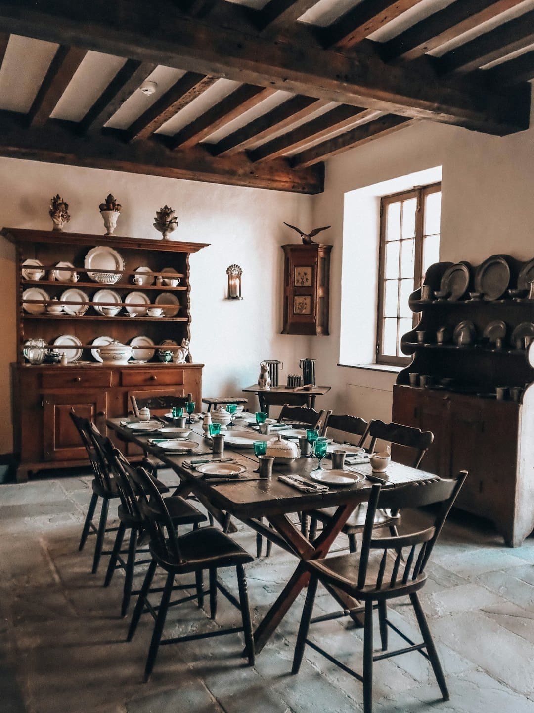 Rustic wooden dining table set in a traditional room.
